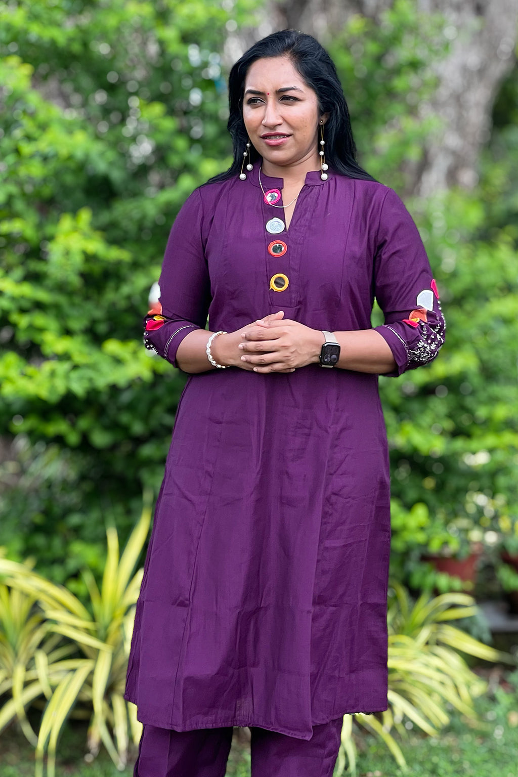 Woman wearing Aroha Amethyst plum co-ord set, front view