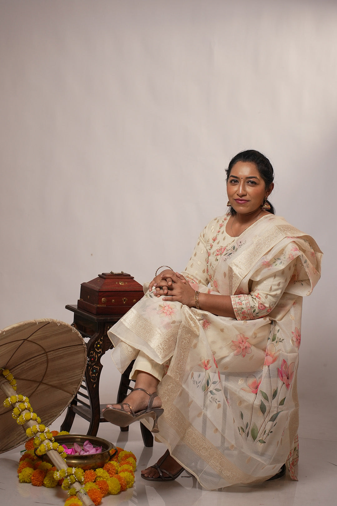 Woman seated wearing Aroha Blush Petals co-ord set