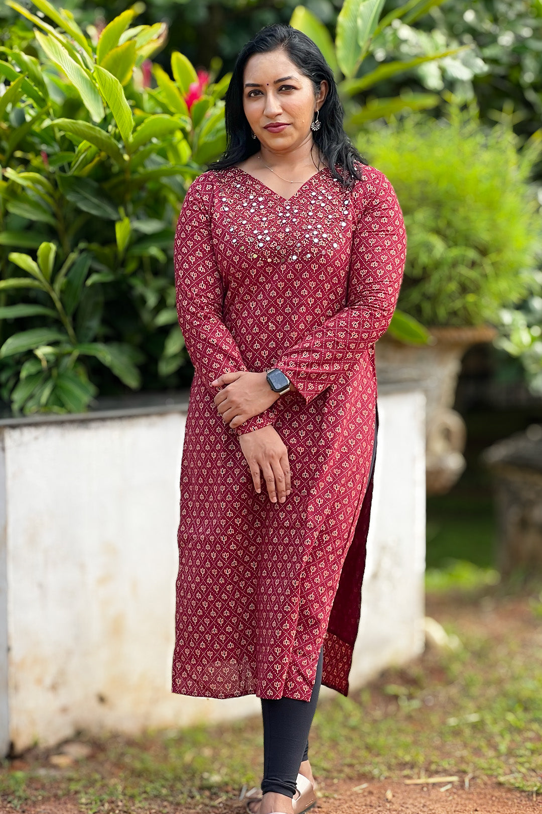 Woman wearing Aroha Chamak maroon cotton kurti, front view