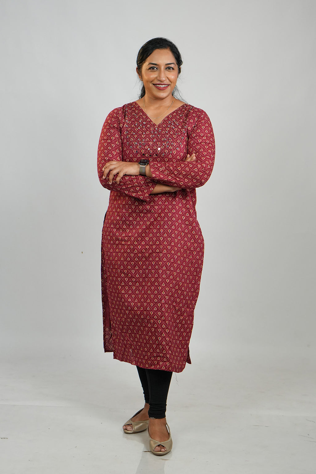 Woman wearing Aroha Chamak Cotton Kurti in maroon with arms crossed