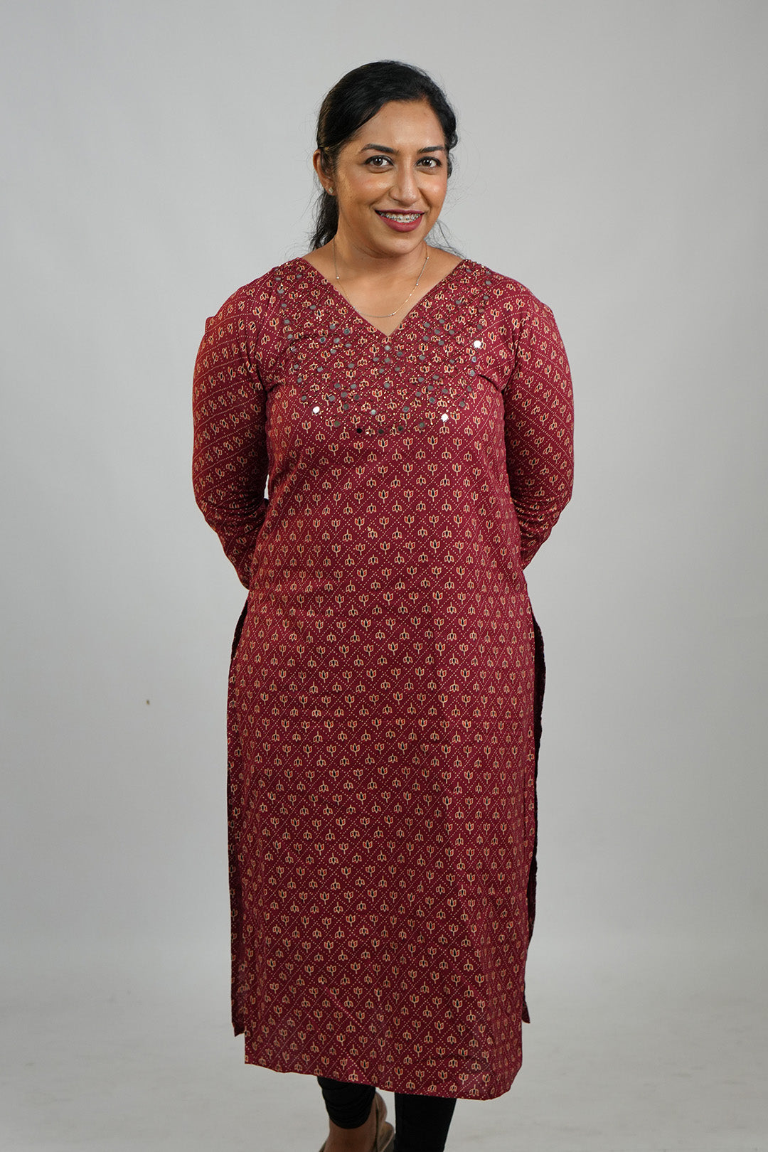 Woman in Aroha Chamak Cotton Kurti standing with hands clasped behind her back