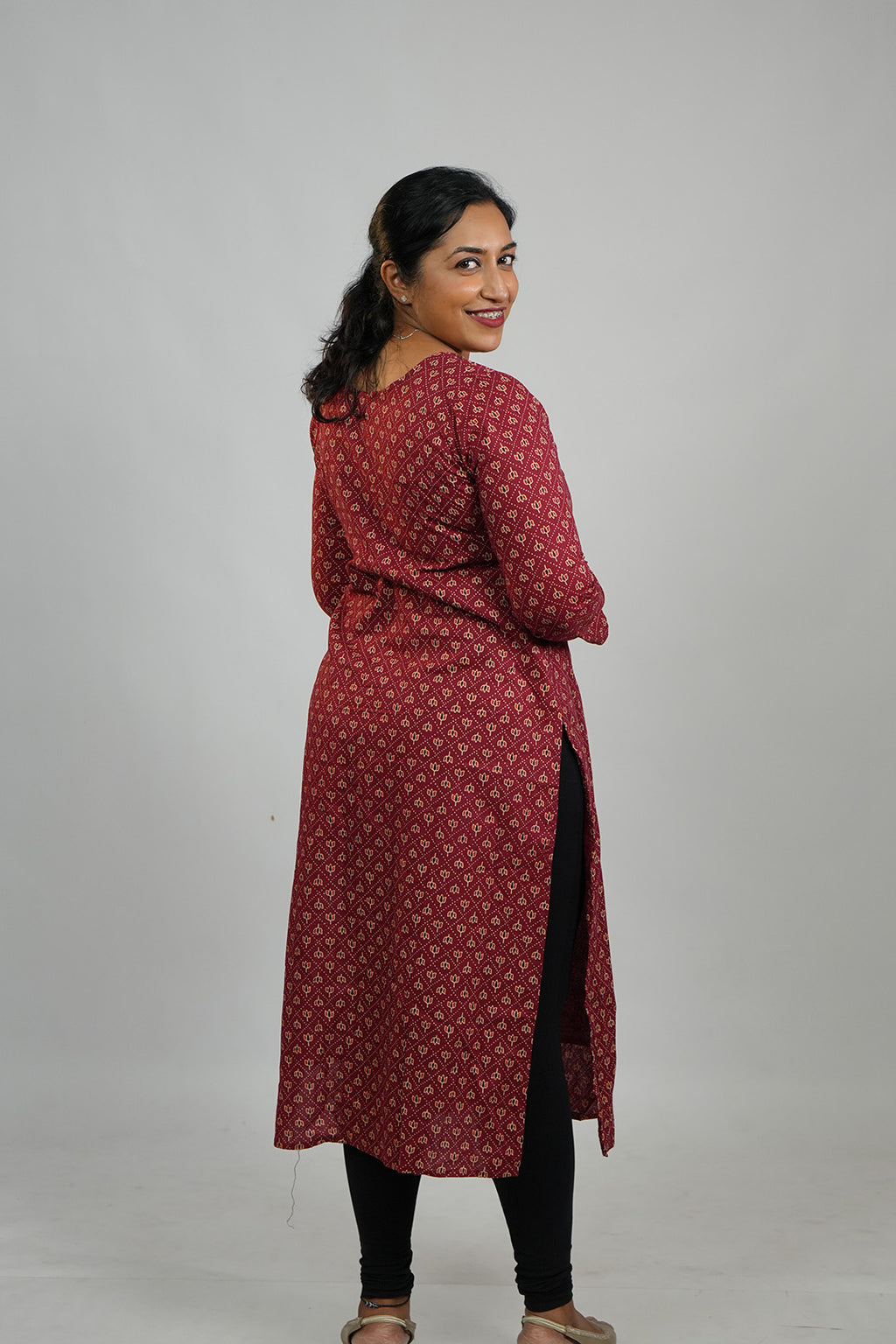 Woman in Aroha Chamak Cotton Kurti posing with an over the shoulder look
