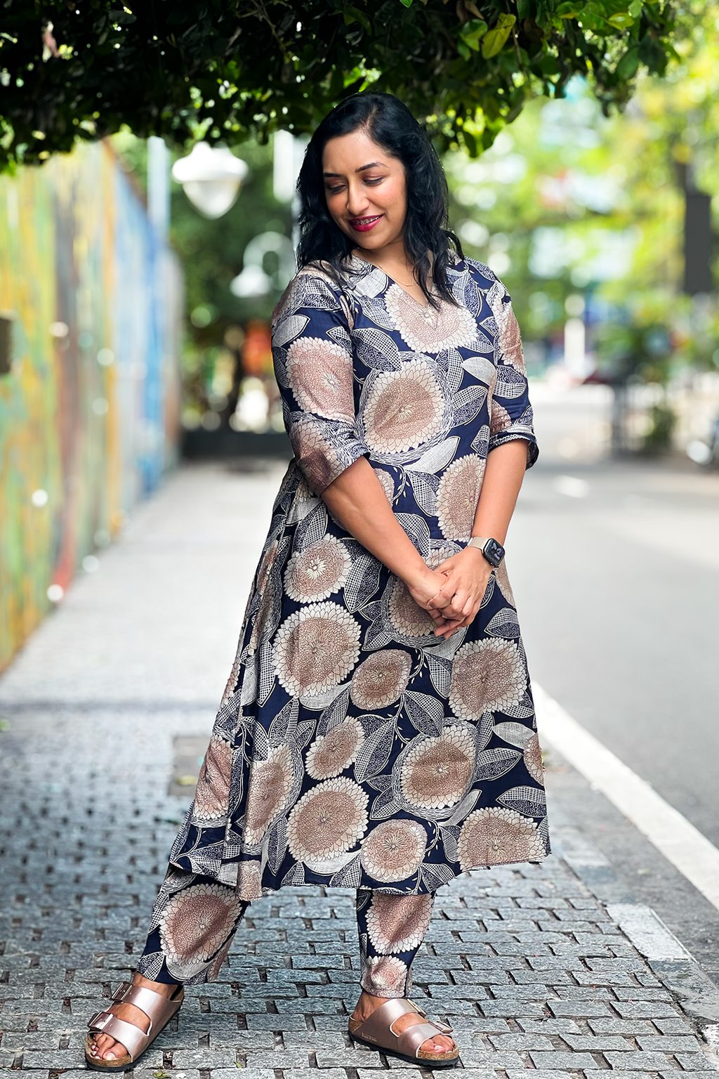 Woman wearing Aroha Dahlia navy floral co-ord set, front view