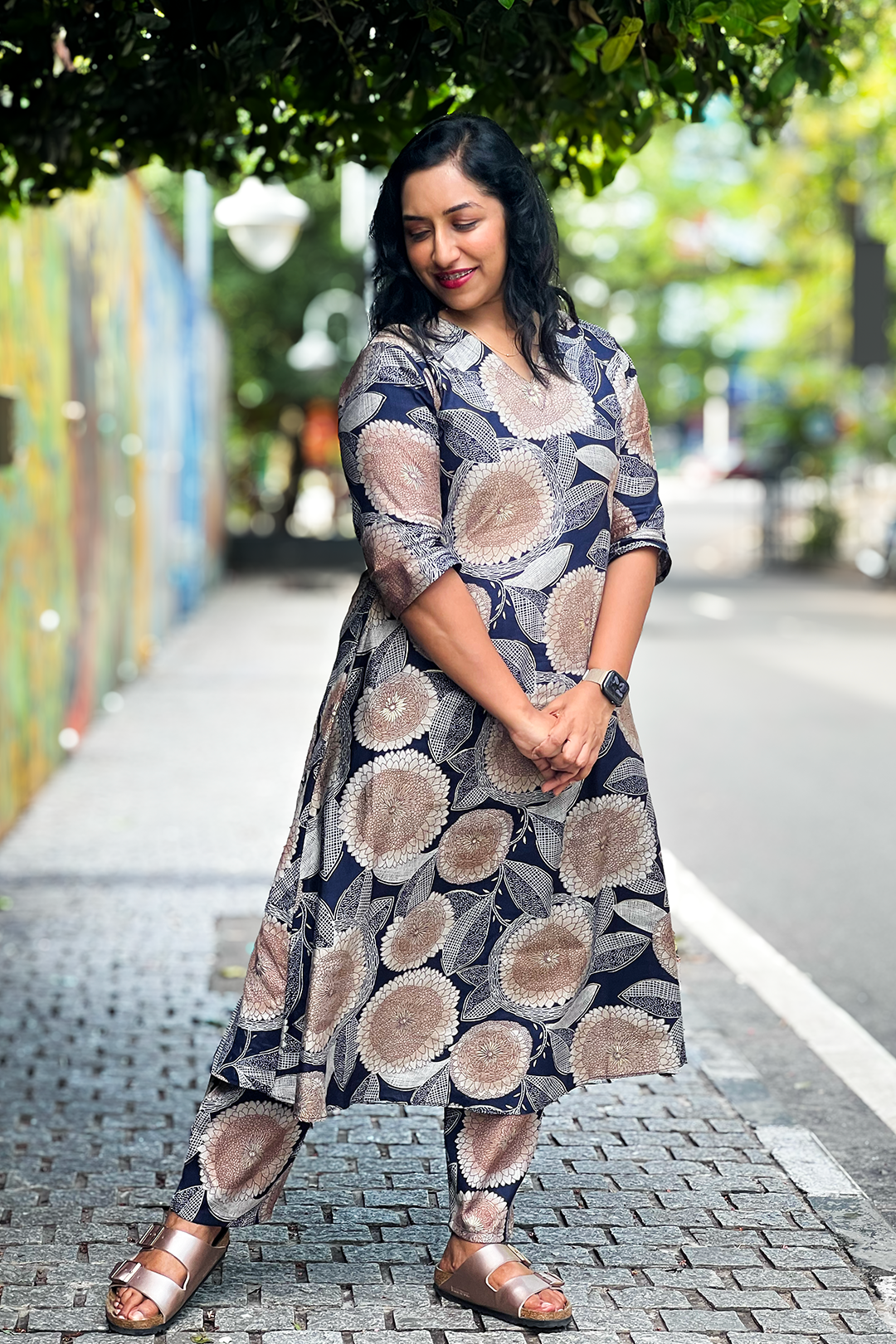 Woman wearing Aroha Dahlia navy floral co-ord set, front view
