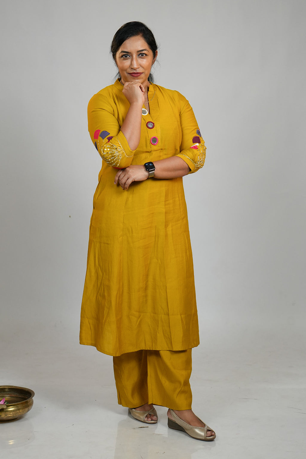 Woman looking directly at the camera wearing Aroha Mustard Muse co-ord set