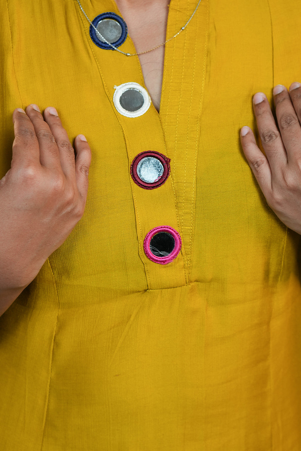Close up of neckline detailing on Aroha Mustard Muse co-ord set