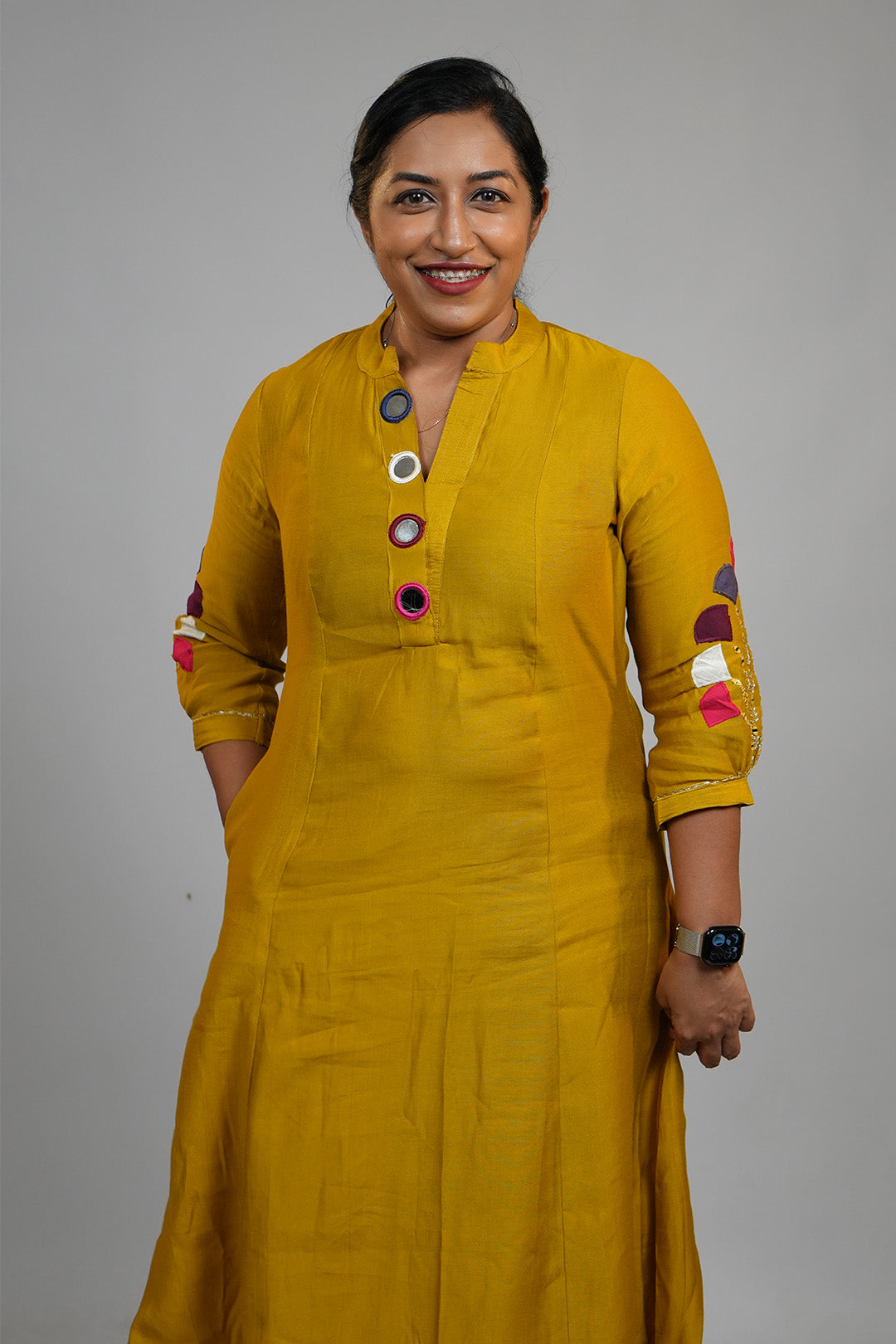 Woman standing in Aroha Mustard Muse golden co-ord set