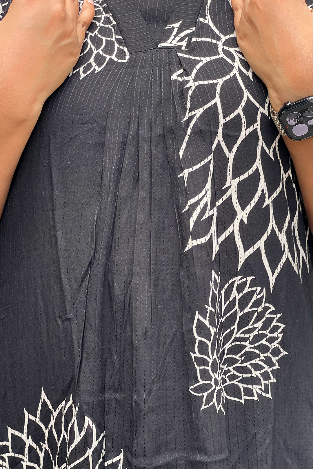 Aroha Noir Bloom neckline close-up with botanical print