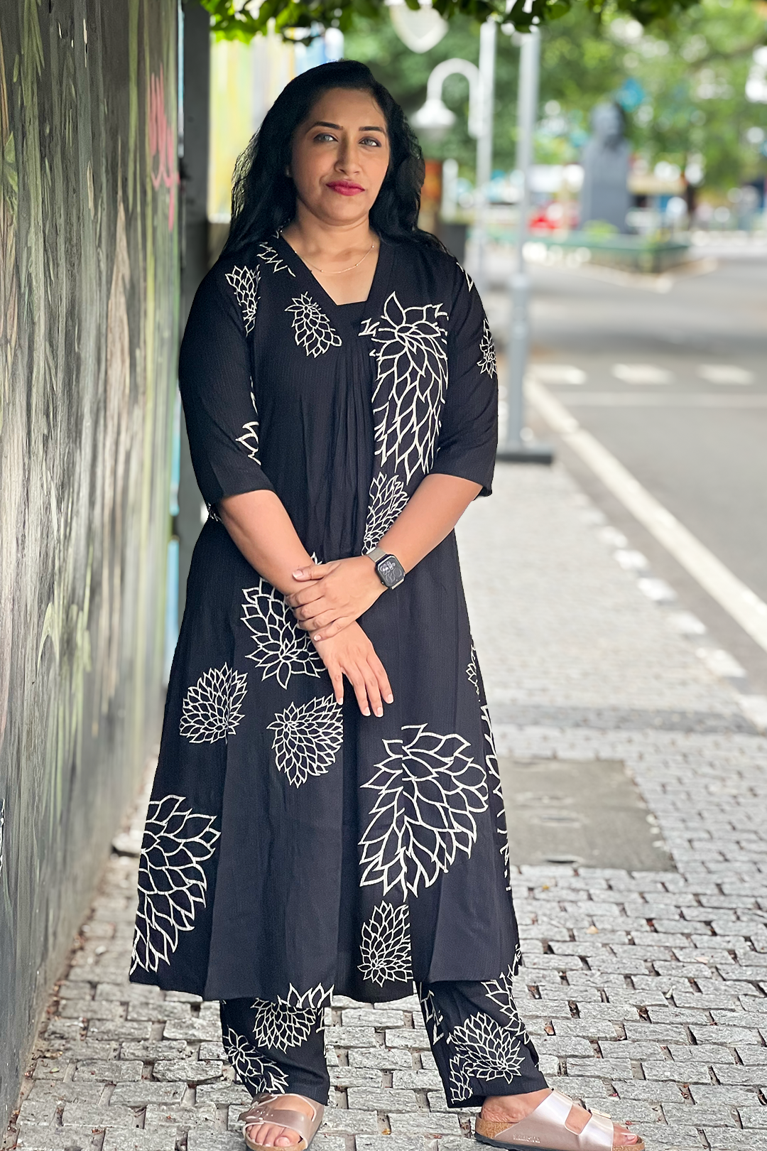 Woman wearing Aroha Noir Bloom black co-ord set, front view