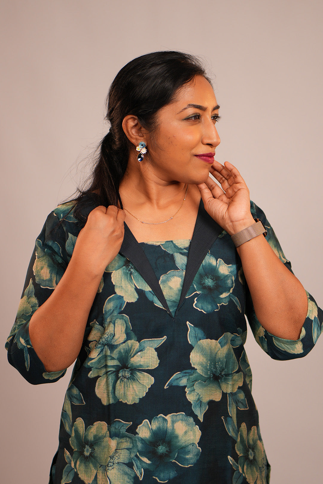 Close up of woman in Aroha Oceanic Bloom co-ord set looking away
