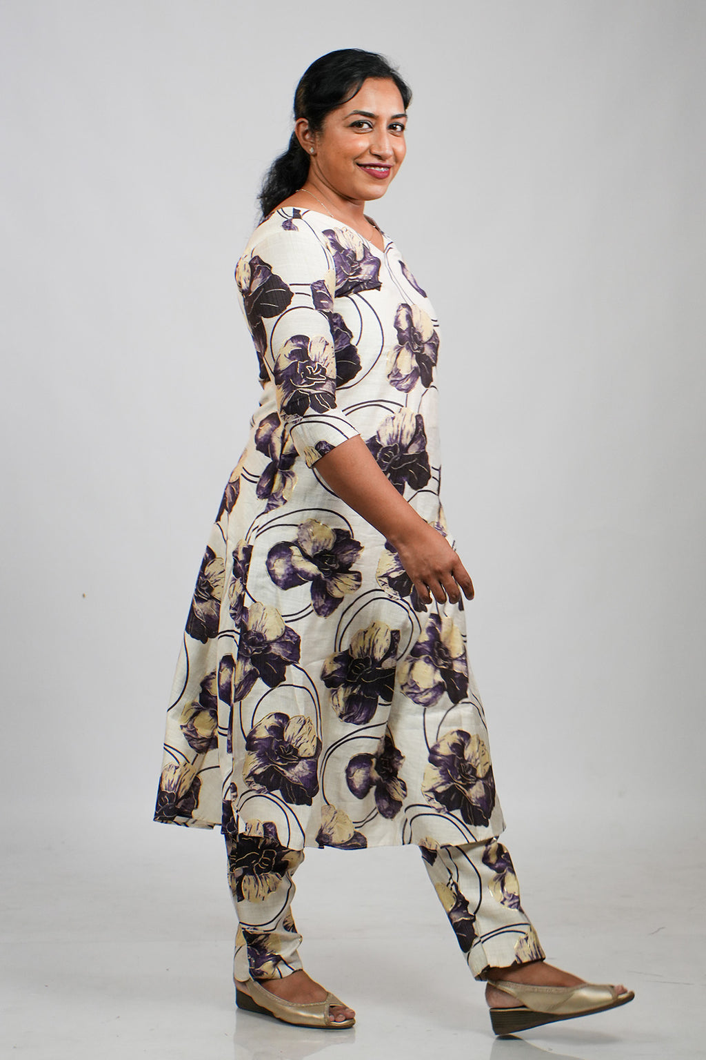Woman walking candidly in Aroha Orchid Muse co-ord set