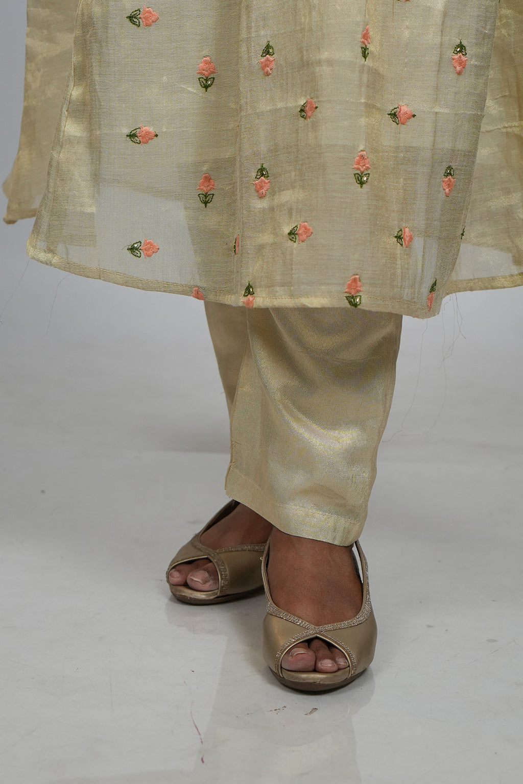 Close up of feet and hem detailing on Aroha Peach Whisper co-ord set