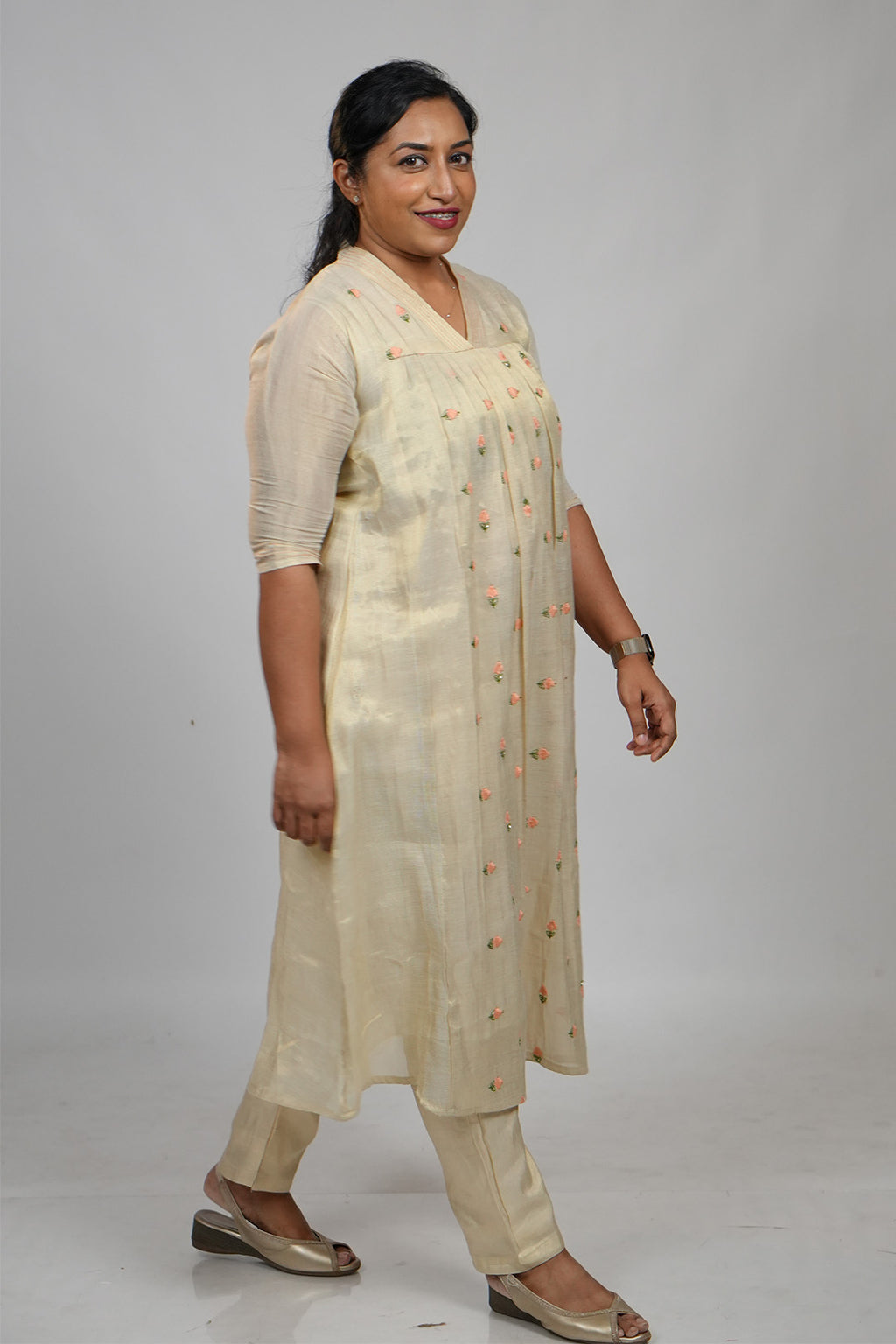 Woman walking candidly in Aroha Peach Whisper co-ord set