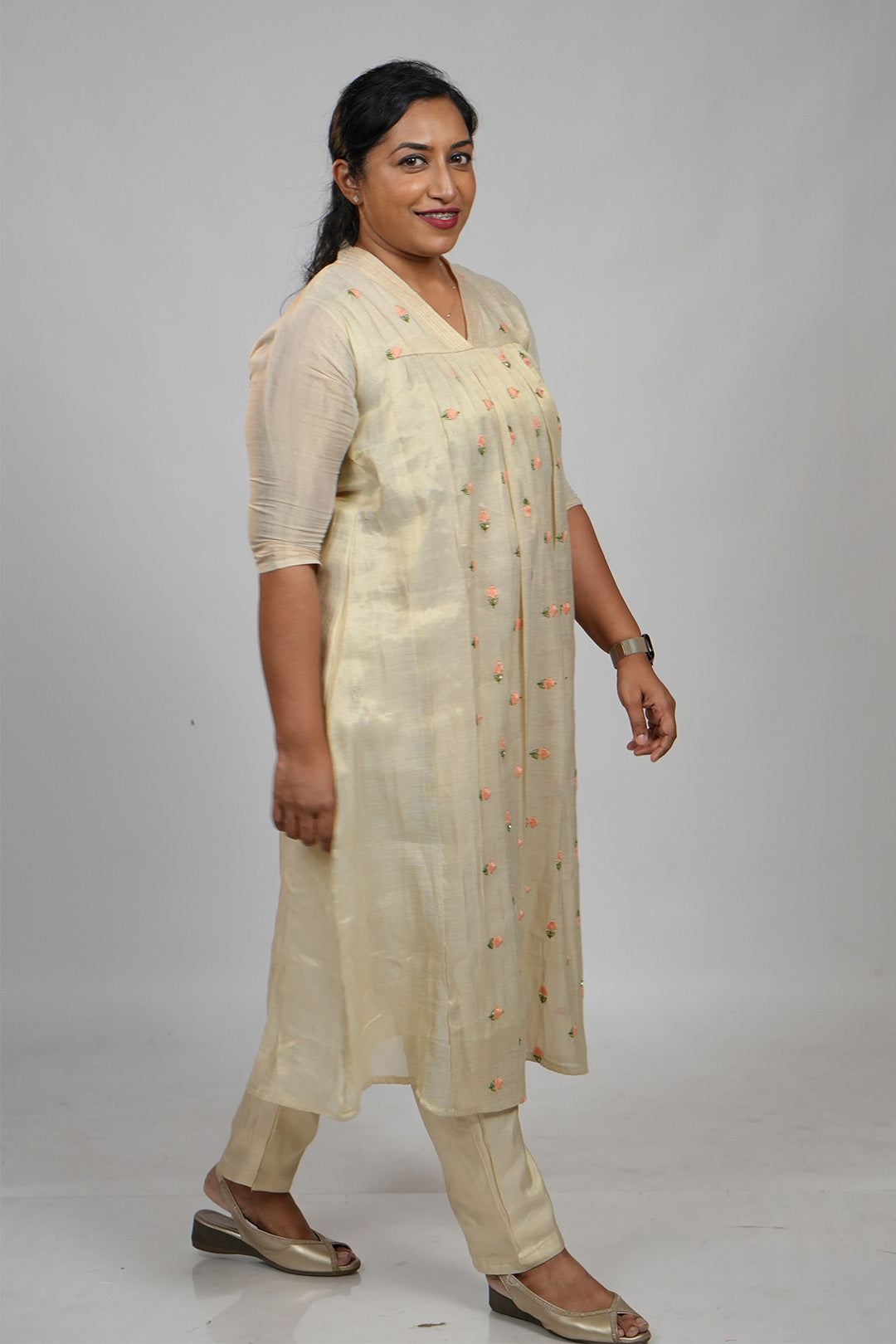 Woman walking candidly in Aroha Peach Whisper co-ord set