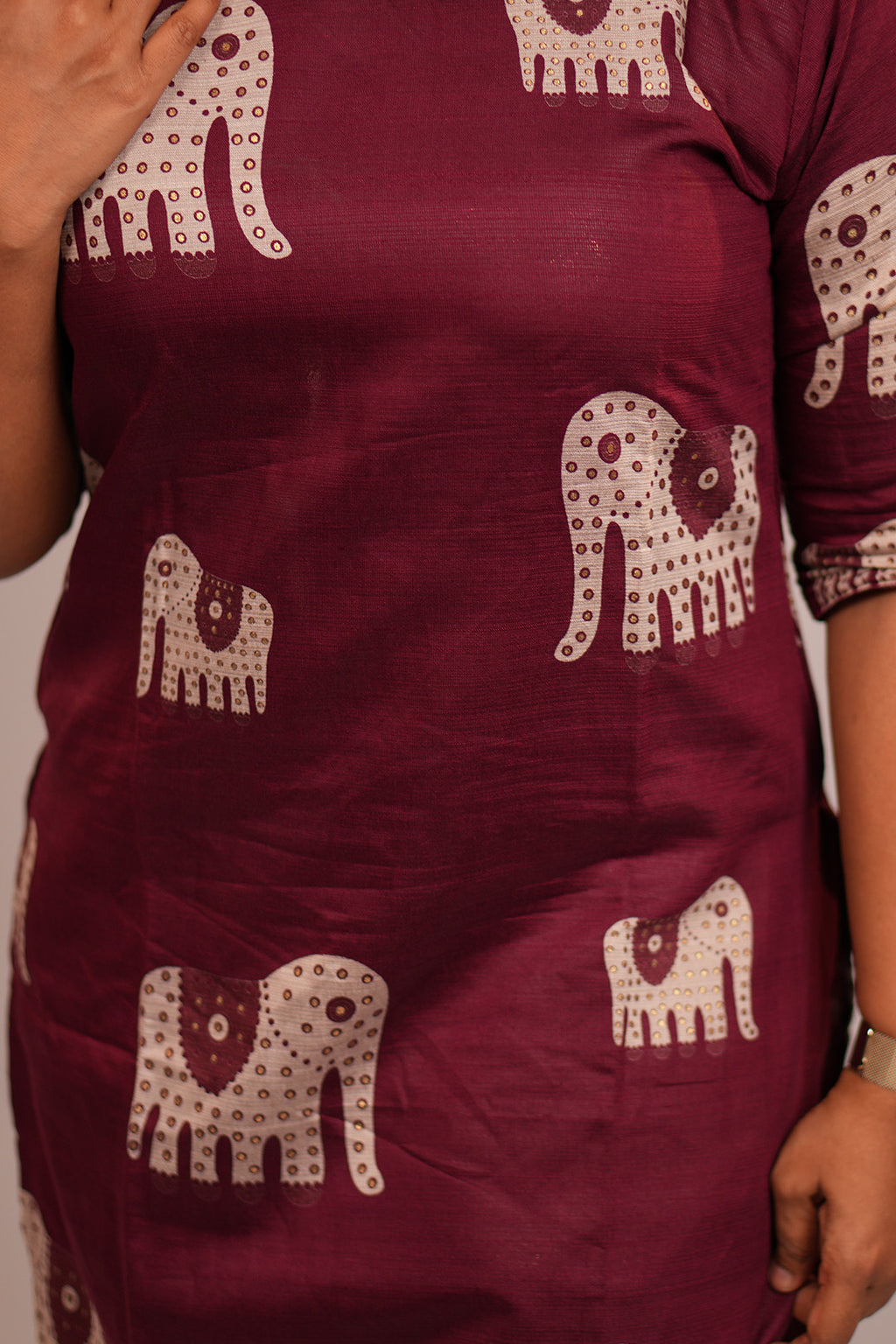 Close up of neckline detailing on Aroha Ruby Elephant co-ord set