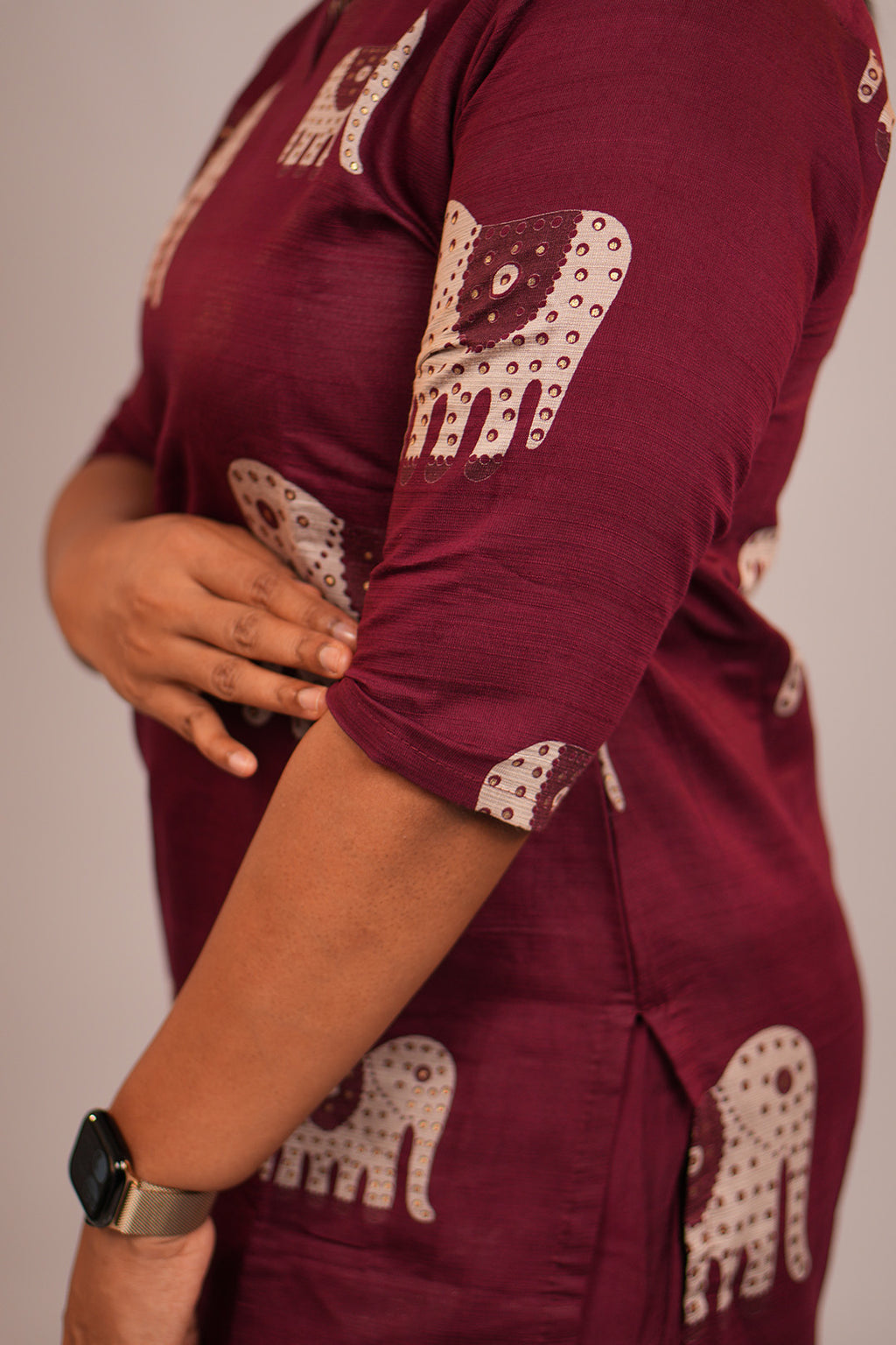 Close up of sleeve detailing on Aroha Ruby Elephant maroon co-ord set