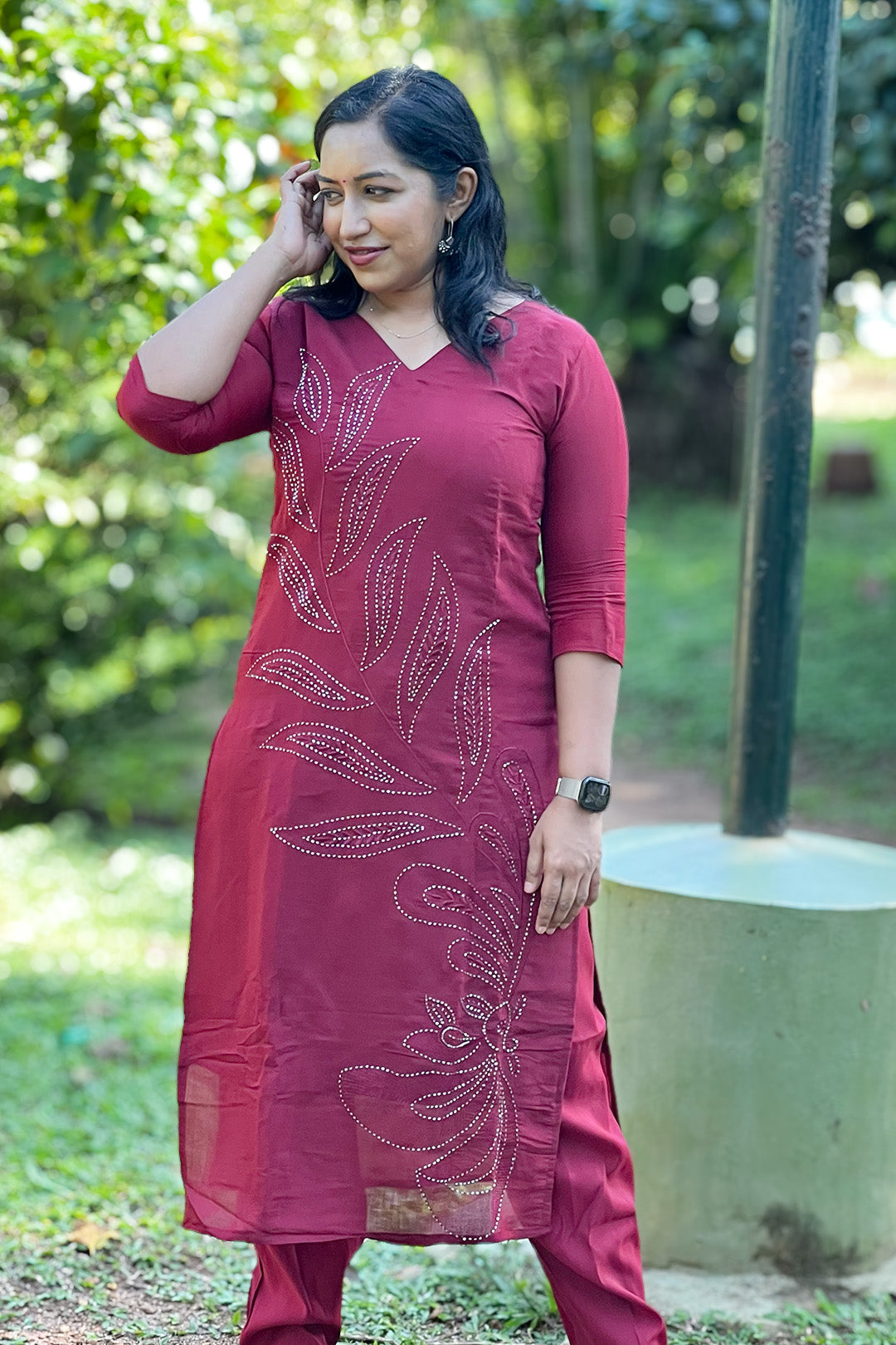 Woman wearing Aroha Ruby Grace maroon co-ord set, front view