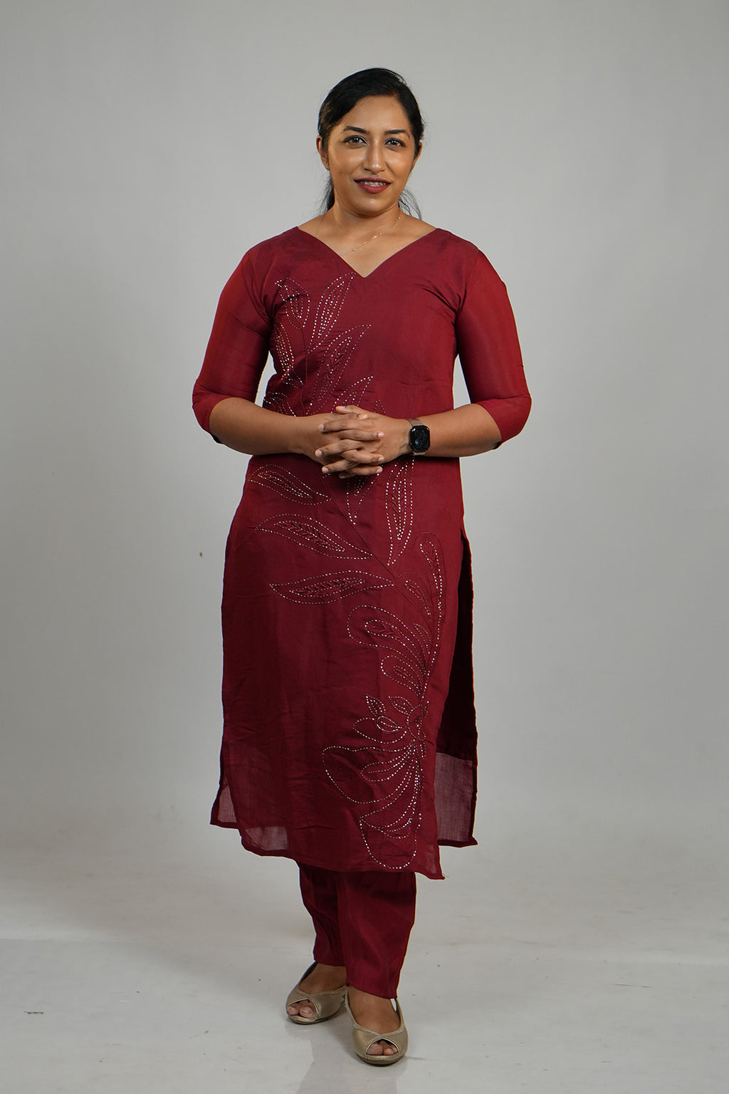 Woman standing in Aroha Ruby Grace maroon co-ord set