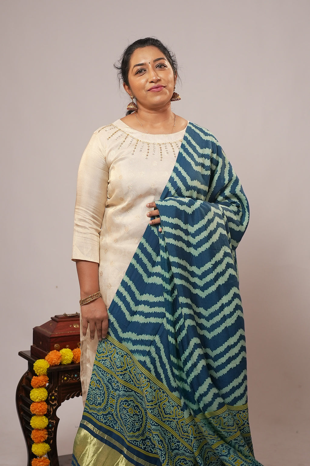Woman standing in Aroha Sea Breeze ivory co-ord set with indigo dupatta