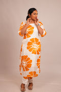 Woman in Aroha Sunflower white co-ord set looking away